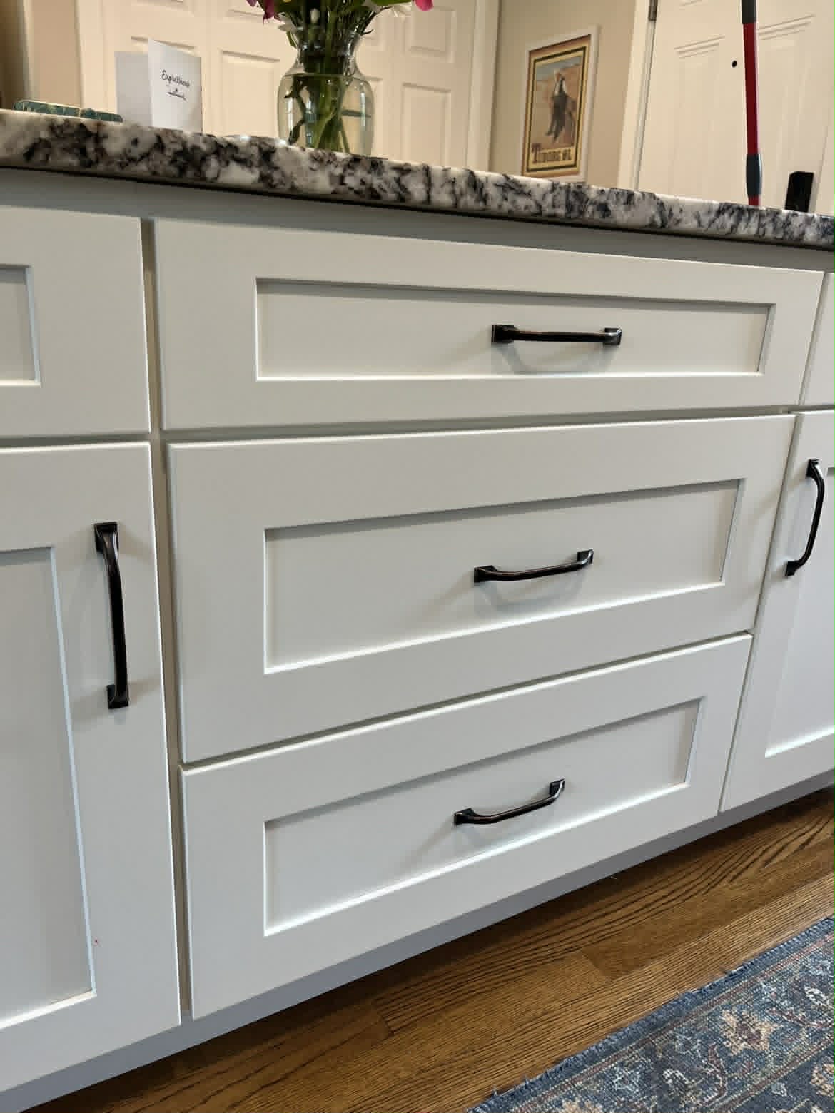 Clean white kitchen island drawers closeup